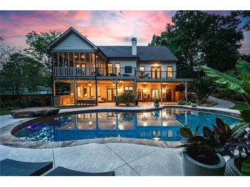 Outdoor oasis featuring a stunning pool and patio, perfect for relaxation and entertaining near the home at 1556 Gaylor Se Dr, Smyrna, GA 30082