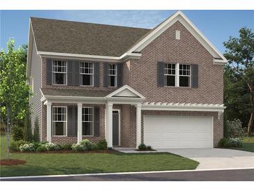 Charming two-story brick home featuring an attached two-car garage and a covered front porch at 5371 Heron Bay Blvd, Locust Grove, GA 30248