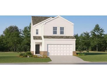 Charming two-story home with attached garage, landscaped lawn and a classic colonial facade at 2288 Linden Pass, Douglasville, GA 30135