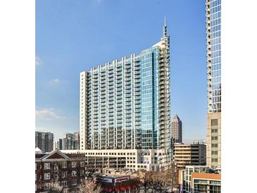 Stunning high-rise building with many windows and balconies against a clear blue sky at 860 Peachtree Street Northeast Ne St # 811, Atlanta, GA 30308