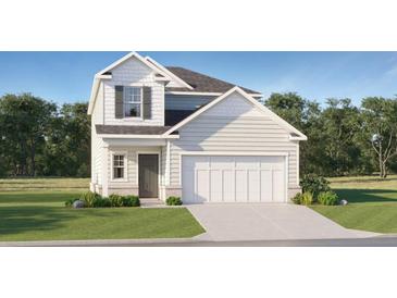 Charming two-story home with a two-car garage, gray door and siding, and a well-manicured lawn at 2340 Treaty Ln, Douglasville, GA 30135