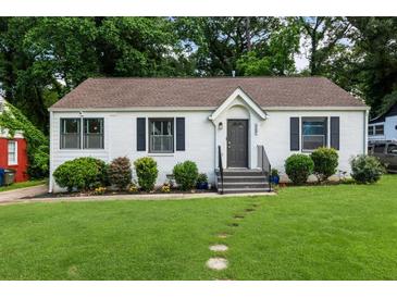 Charming single-story home with black shutters and a well-manicured lawn at 429 Deckner Sw Ave, Atlanta, GA 30310