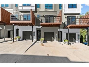 Modern townhomes featuring private garages, balconies, and contemporary architectural details at 2325 Mason Dr # D22, Atlanta, GA 30316