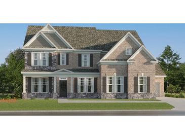 Stunning two-story home boasts a brick facade and charming shutters at 255 Deer Valley Run, Canton, GA 30115