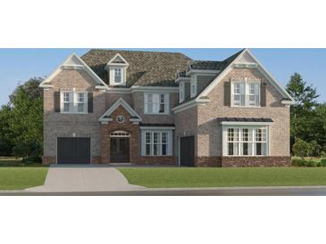 Stunning two-story brick home featuring attached garage and a well manicured lawn at 243 Deer Valley Run, Canton, GA 30115