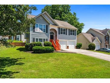 Charming two-story home with a well-manicured lawn and beautiful landscaping at 4426 High Gate Nw Dr, Acworth, GA 30101