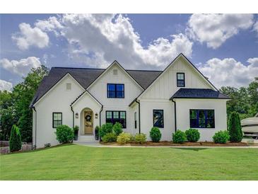 Charming two-story home with a well-manicured lawn and beautiful landscaping at 270 Alcovy Reserve Way, Covington, GA 30014