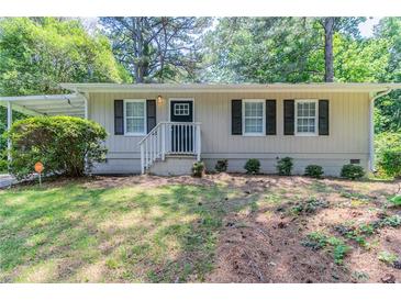 Charming single-story home with neutral siding, black shutters, and a welcoming front porch at 881 Mercury Nw Dr, Atlanta, GA 30331