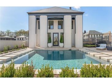 Stunning pool area with modern design and luxurious features, perfect for relaxation and entertainment at 245 Roycroft Ln, Fayetteville, GA 30214