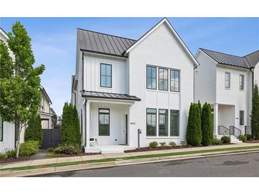 Charming two-story home with white brick exterior and black window trim at 6815 Halcyon Way, Alpharetta, GA 30005