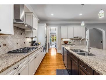 Modern kitchen featuring granite counters, stainless steel appliances, and a functional island at 504 S Westminster Ne Way, Atlanta, GA 30307