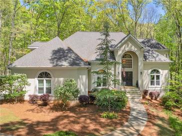 Charming home with a well-manicured lawn, beautiful landscaping, and a welcoming entrance at 3500 Lost Valley Dr, Jonesboro, GA 30236