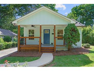 Charming home featuring a welcoming front porch with wooden posts and a well-manicured lawn at 5 Windsor Ter, Avondale Estates, GA 30002