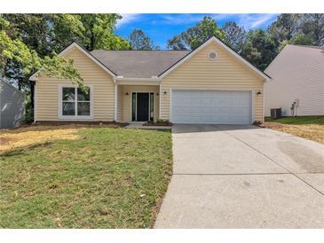 Charming single Gathering home with a well manicured lawn and a two car garage at 2601 Garland Way, Duluth, GA 30096