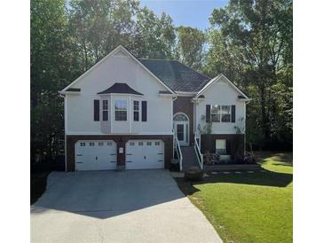 Charming two-story home with attached two-car garage, landscaped yard, and a traditional design at 40 Legend Creek, Douglasville, GA 30134