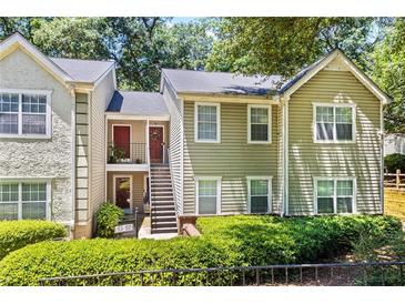 Inviting townhome with traditional architecture and landscaped front yard at 98 Hampshire Ct, Avondale Estates, GA 30002