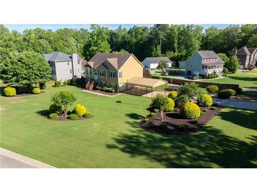 Charming two-story home with a spacious lawn and a convenient covered parking area at 638 Oberlochen Way, Douglasville, GA 30134