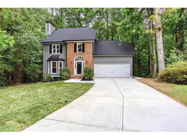 Charming two-story home with brick accents and a well-manicured lawn at 4806 Deer Chase, Powder Springs, GA 30127