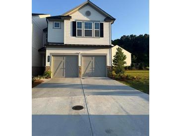 Charming two-story home with a two-car garage and neutral color palette at 3848 Hester St, Duluth, GA 30097