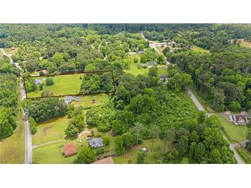 Expansive acreage with mature trees ready for your dream home at 3517 Plunkett Rd, Stonecrest, GA 30038