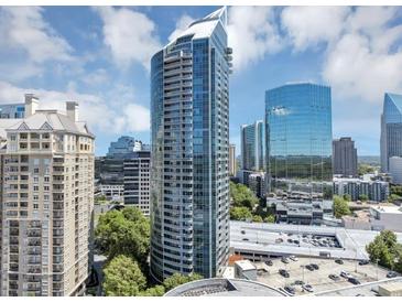 Stunning view of a modern high-rise building with curved architecture and glass facade at 3338 Peachtree Ne Rd # 508, Atlanta, GA 30326