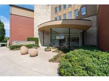 Inviting building entrance featuring manicured landscaping and modern architectural elements at 400 17Th Nw St # 1321, Atlanta, GA 30363