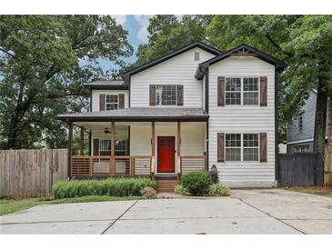 Charming two-story home with a welcoming front porch and a vibrant red door at 2411 Second Ave, Decatur, GA 30032