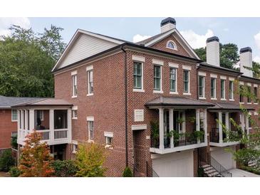 Stunning brick townhouse with a covered porch and balcony, perfect for enjoying the outdoors at 3734 Paige Ne Way # 10, Atlanta, GA 30319