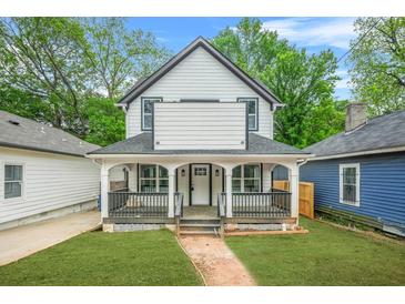 Charming two-story home with a welcoming front porch and beautifully landscaped yard at 1090 Mcdaniel St, Atlanta, GA 30310