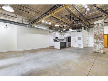 Spacious kitchen features white cabinets, an island and stainless steel appliances at 505 Whitehall Sw St # 102, Atlanta, GA 30303