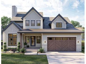 Charming two-story home featuring a brick facade, gray siding, a covered porch, and a two-car garage at 0 Paige St, Dallas, GA 30157