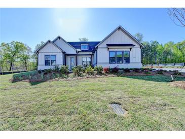 Beautiful single Gathering home with verdant lawn and landscaping at 2750 Herrington Dr, Cumming, GA 30041