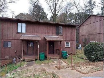 Quaint multi-Gathering home featuring a modest front porch and wooded surroundings at 3502 Sleeping Fawn Knls, Decatur, GA 30034