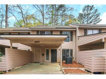 Inviting townhome with a covered parking area, showcasing a blend of comfort and convenience at 4870 Twin Lakes Trail, Atlanta, GA 30360
