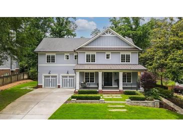 Charming two-story home with a manicured front yard and a two-car garage at 4048 Navajo Trl, Brookhaven, GA 30319