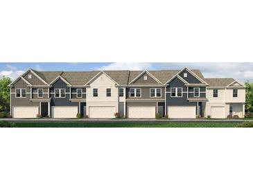 Charming new townhome exteriors with modern siding, attached garages, and manicured landscaping at 1346 Magnolia Bend Way # 285, Jonesboro, GA 30238
