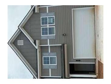 Charming two-story home with gray siding, white trim, and a convenient attached garage at 1021 Merritt Dr # 101, Villa Rica, GA 30180