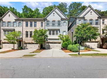 Charming townhomes featuring attached garages, brick accents, and well-maintained landscaping in a desirable neighborhood at 2506 Skyland Ne Dr # 17, Atlanta, GA 30319