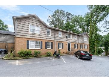 Inviting exterior of a multi-Gathering building with brick facade and ample parking space at 3626 Buford Ne Hwy # C1, Brookhaven, GA 30329
