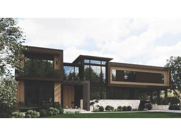 Modern home exterior boasts clean lines, large windows, and a well-manicured lawn, creating a sophisticated curb appeal at 654 Longleaf Dr, Atlanta, GA 30342