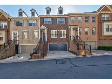 Beautiful brick townhomes with well-maintained landscaping and attached garages at 2767 Durham Ne Dr, Atlanta, GA 30319