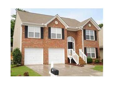 Charming two-story brick home with a two-car garage and manicured front lawn at 2918 Egret Ln, Austell, GA 30106