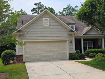Charming home with a two-car garage, manicured lawn, and mature trees, offering great curb appeal at 2948 Goldfinch Cir, Marietta, GA 30066
