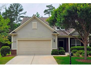 Charming one-story home with a two-car garage, manicured lawn and mature trees offering great curb appeal at 2948 Goldfinch Cir, Marietta, GA 30066