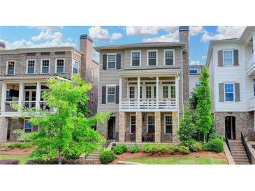Charming two-story home with stone accents and a welcoming front porch, nestled in a well-maintained community at 221 Thompson St, Alpharetta, GA 30009