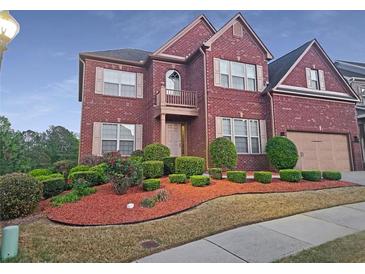 Beautiful two-story brick home with manicured landscaping and attached two-car garage at 3623 Terrah Point Dr, Duluth, GA 30097