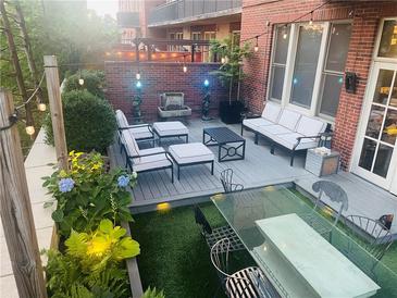 Charming outdoor patio space featuring comfortable seating, string lights, and elegant decor for relaxing or entertaining at 3180 Mathieson Drive # 502, Atlanta, GA 30305