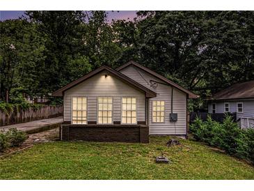 Charming single-story home featuring neutral siding and a welcoming front yard at 523 Mount Zion, Hapeville, GA 30354
