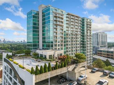 Modern high-rise building with glass facade and balconies, showcasing urban living and architecture at 250 Pharr Ne Rd # 1814, Atlanta, GA 30305