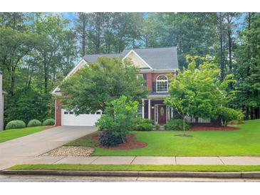 Charming two-story brick home with well-maintained landscaping and a two-car garage at 3522 Estates Landing Nw Dr, Kennesaw, GA 30144